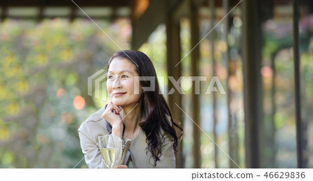 Middle senior woman restaurant wine travel image 46629836