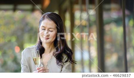 Middle senior woman restaurant wine travel image 46629837