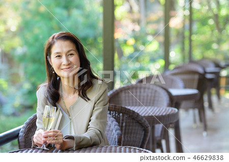 Middle senior woman restaurant wine travel image 46629838