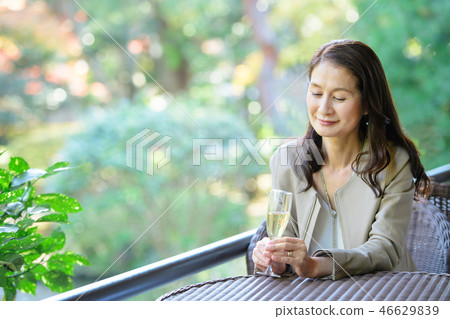 Middle senior woman restaurant wine travel image 46629839