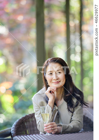 Middle senior woman restaurant wine travel image 46629977