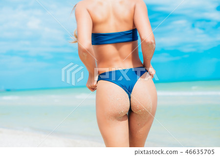 A beautiful young girl in a blue swimsuit A beautiful young girl in a blue swimsuit 46635705
