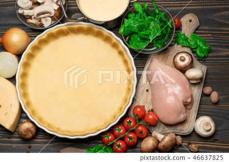 shortbread dough for baking quiche tart and ingredients in baking form shortbread dough for baking quiche tart and ingredients in baking form 46637825