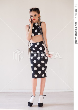 beautiful fashionable woman in a dress with white circles portrait 46638182