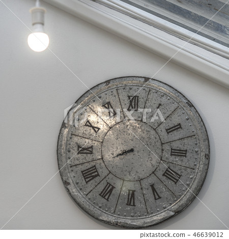 Clock and light bulb hanging Clock and light bulb hanging 46639012