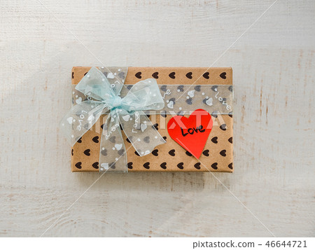 Box with a gift, tied with a ribbon 46644721