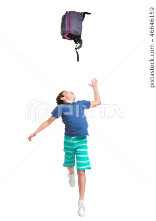 Full length portrait of cute little kid in stylish clothes jumping with bag 46646159