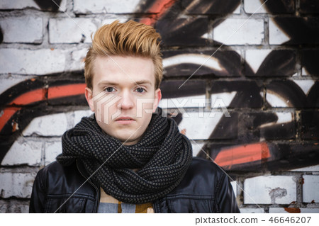Fashion male portrait on graffiti wall Fashion male portrait on graffiti wall 46646207