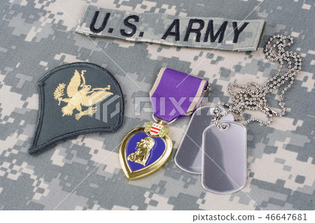 Purple Heart award on camouflage uniform Purple Heart award on camouflage uniform 46647681