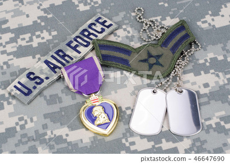 Purple Heart award on camouflage uniform 46647690