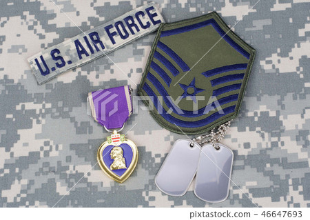 Purple Heart award on camouflage uniform 46647693