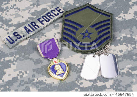Purple Heart award on camouflage uniform 46647694