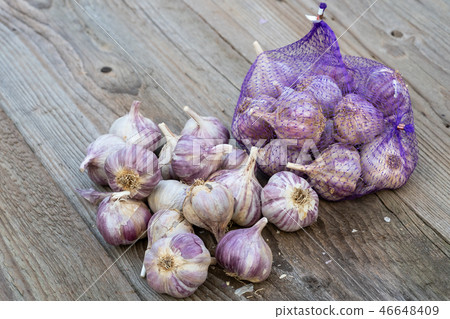 Garlic on wooden vintage background. 46648409