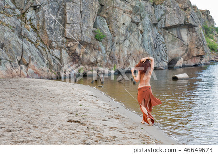 young beautiful naked Amazon woman on river beach 46649673