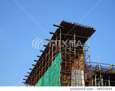 Metal scaffolding at the construction site  46650044