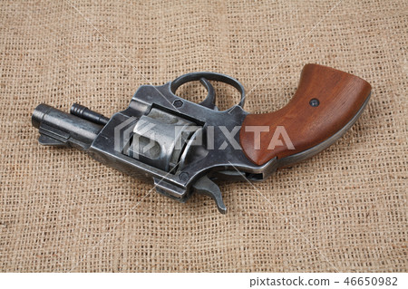 Revolver on the canvas background 46650982