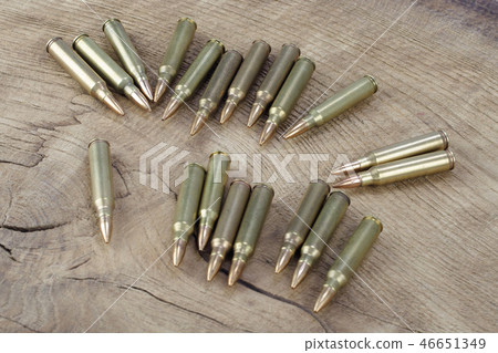 Ammunition on wooden background 46651349