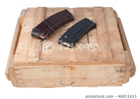 m16 and ak47 magazins on wooden box 46651433