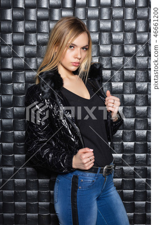 Attractive blonde posing on a white sofa Attractive blonde posing on a white sofa 46661200