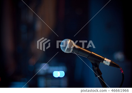 Microphone at concert hall on blue background Microphone at concert hall on blue background 46661966