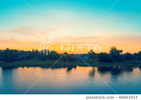 Village by the lake at sunrise 46663833