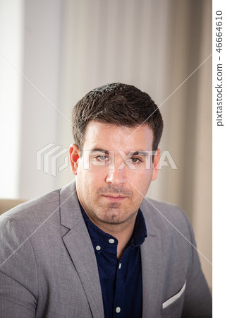 Portrait of businessman in conference room looking away Portrait of businessman in conference room looking away 46664610