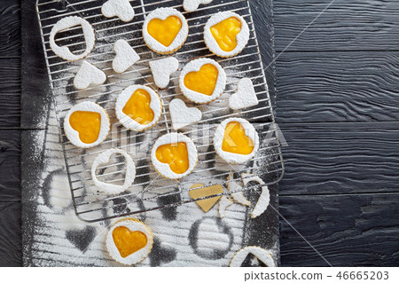 linzer cookies with mango jam, top view 46665203