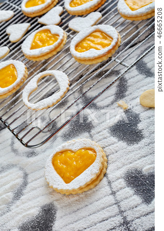Heart shaped linzer cookies on a wire rack 46665208