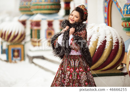 traditional russian winter dress Beautiful longhaired blonde young girl in russian traditional national clothes in winter