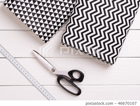 Tailor scissors and cloth top view. 46670107