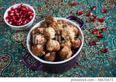 Juicy meat meatballs with pomegranate seeds. 46670873