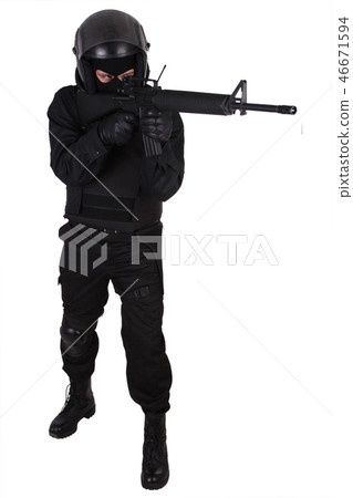 Riot police officer with weapon in black uniform Riot police officer with weapon in black uniform 46671594