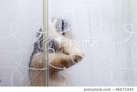 Young woman taking a shower 46671845
