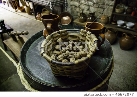 Dried walnuts in a Christmas basket Dried walnuts in a Christmas basket 46672077