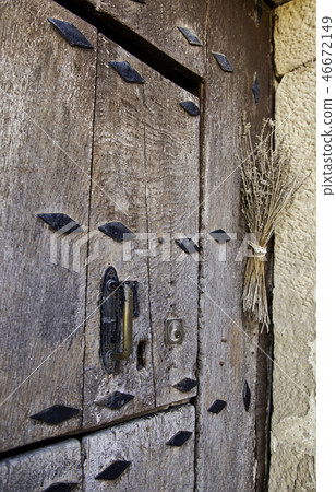 Old medieval wooden door with lock Old medieval wooden door with lock 46672149