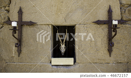 Skull of goat and crucifixes Skull of goat and crucifixes 46672157