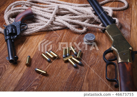 Wild west rifle, ammunition and sheriff badge Wild west rifle, ammunition and sheriff badge 46673755