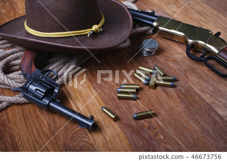 Wild west rifle, ammunition and sheriff badge Wild west rifle, ammunition and sheriff badge 46673756