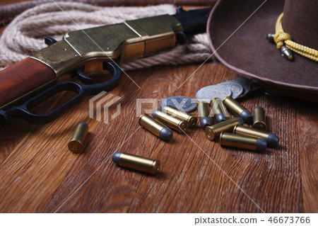 Wild west rifle, ammunition and sheriff badge 46673766
