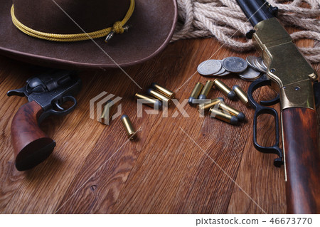 Wild west rifle, ammunition and sheriff badge Wild west rifle, ammunition and sheriff badge 46673770