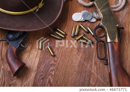 Wild west rifle, ammunition and sheriff badge Wild west rifle, ammunition and sheriff badge 46673771