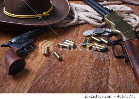 Wild west rifle, ammunition and sheriff badge Wild west rifle, ammunition and sheriff badge 46673773