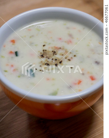 Vegetable soup in a ceramic cup Vegetable soup in a ceramic cup 46677061