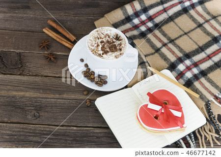 Cup of cappuccino, heart shaped cookies Cup of cappuccino, heart shaped cookies 46677142