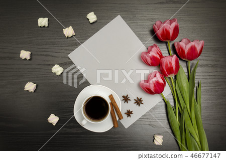 Holiday concept. Bouquet of pink tulips, a cup Holiday concept. Bouquet of pink tulips, a cup 46677147