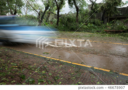 electric taxi driving on road after super typhoon electric taxi driving on road after super typhoon 46678907