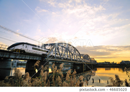 Keisei Skyliner crossing Arakawa Bridge in afterglow 46685020