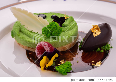 A fantastic dessert with a ball of chocolate ice c A fantastic dessert with a ball of chocolate ice c 46687260