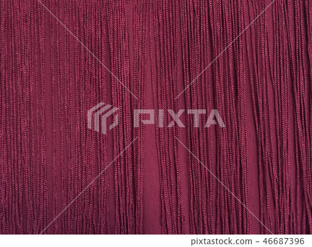 Maroon fabric with fringe. Close-up. Background Maroon fabric with fringe. Close-up. Background 46687396