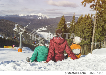 Mother and two sons are sitting 46687445